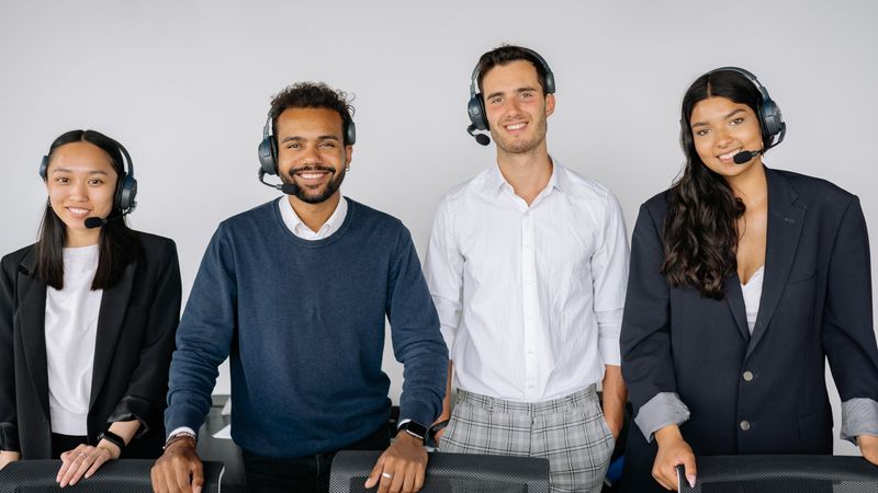Customer support team wearing headsets